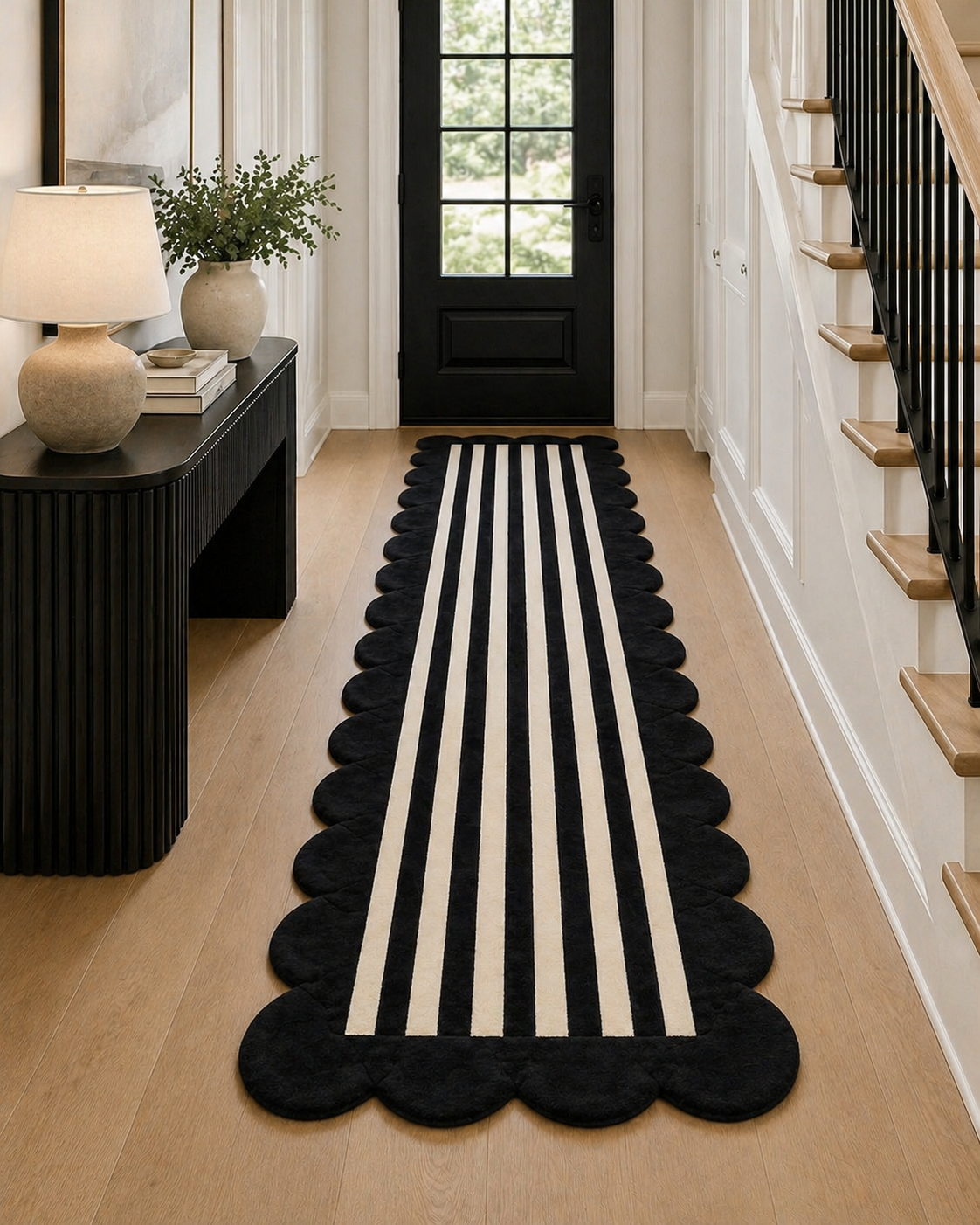 Black and white striped runner rug on a wooden floor with a side table and lamp in the background.