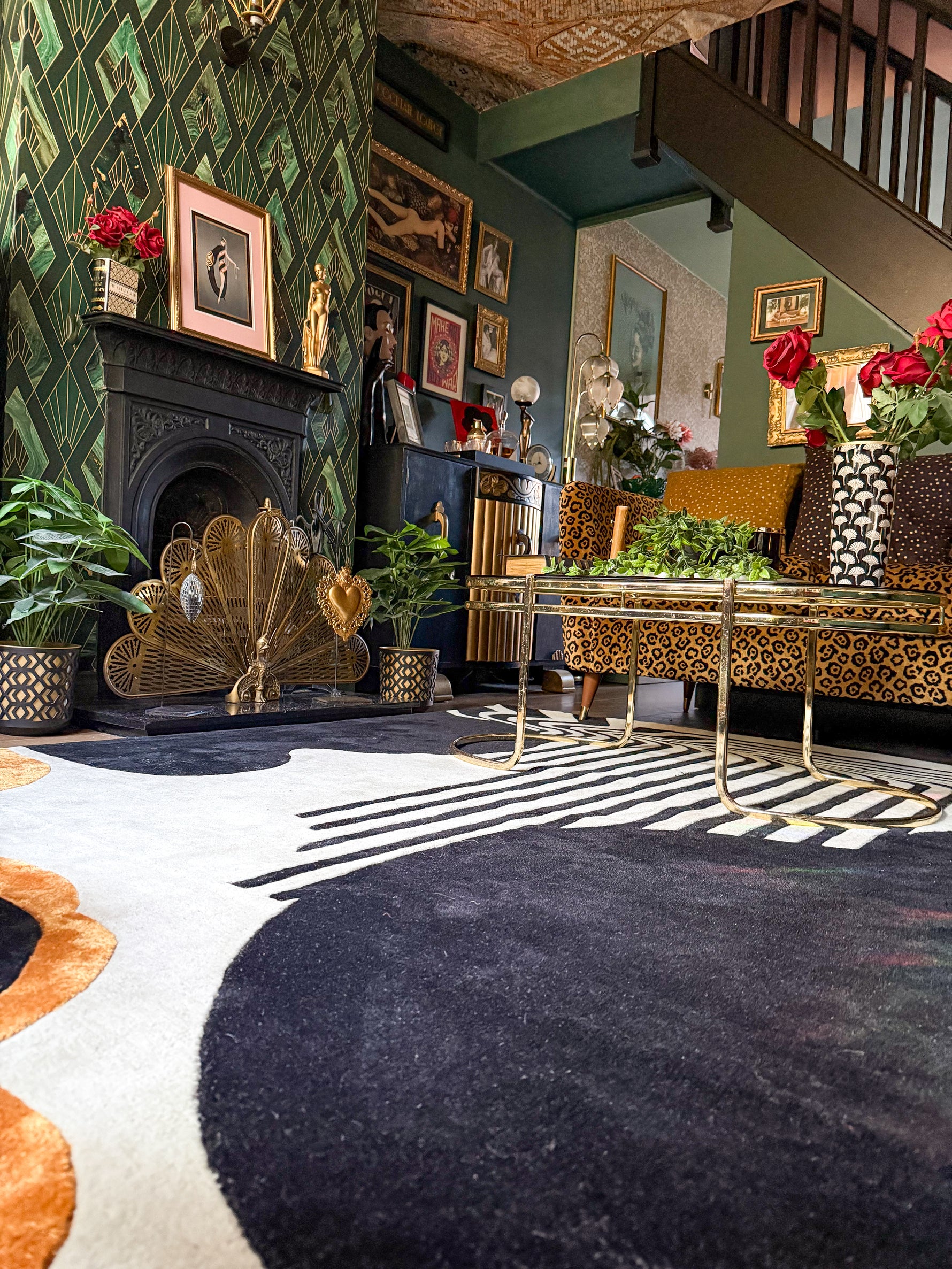 Luxurious living room with decorative rug and a fireplace.