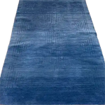 Explore the Blue Arctic Geo Modern Hand Tufted Wool Rug, an elegant 8 x 10 ft area rug perfect for enhancing your living room or dining room. This plush wool rug features a sophisticated geometric pattern, offering both comfort and style as a centerpiece for your space.