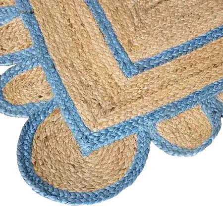 Close-up of a Blue Scalloped Border Jute Rug Runner, showcasing intricate woven patterns ideal for use as an area rug in hallways, kitchens, bedrooms, or dining rooms. The natural jute material is highlighted with a decorative blue scalloped edge, perfect for adding a touch of elegance to any space.