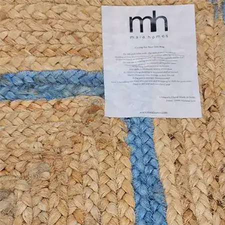 Close-up view of a Blue Scalloped Border Jute Rug Runner, showcasing its natural woven texture and blue accents. Perfect as an area rug for hallways, kitchens, bedrooms, dining rooms, or bathrooms, this versatile jute rug adds a touch of elegance to any space.