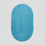 Blue oval rug on a light gray background