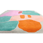 Multicolored abstract rug with shapes on a white background