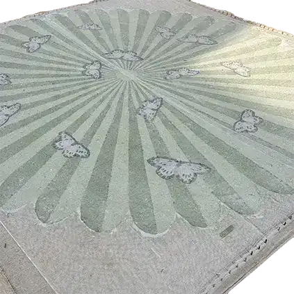 Light green hand-tufted wool area rug featuring a round design with butterflies over a flower pattern, perfect for adding a touch of elegance to your living room or office space.