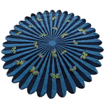 A beautifully designed round wool rug featuring a vibrant pattern of butterflies over a flower motif, ideal for adding a splash of color to bedrooms or living rooms. This hand-tufted area rug, with its striking blue tones, is perfect for anyone looking for large area rugs or unique rugs for bedroom settings.