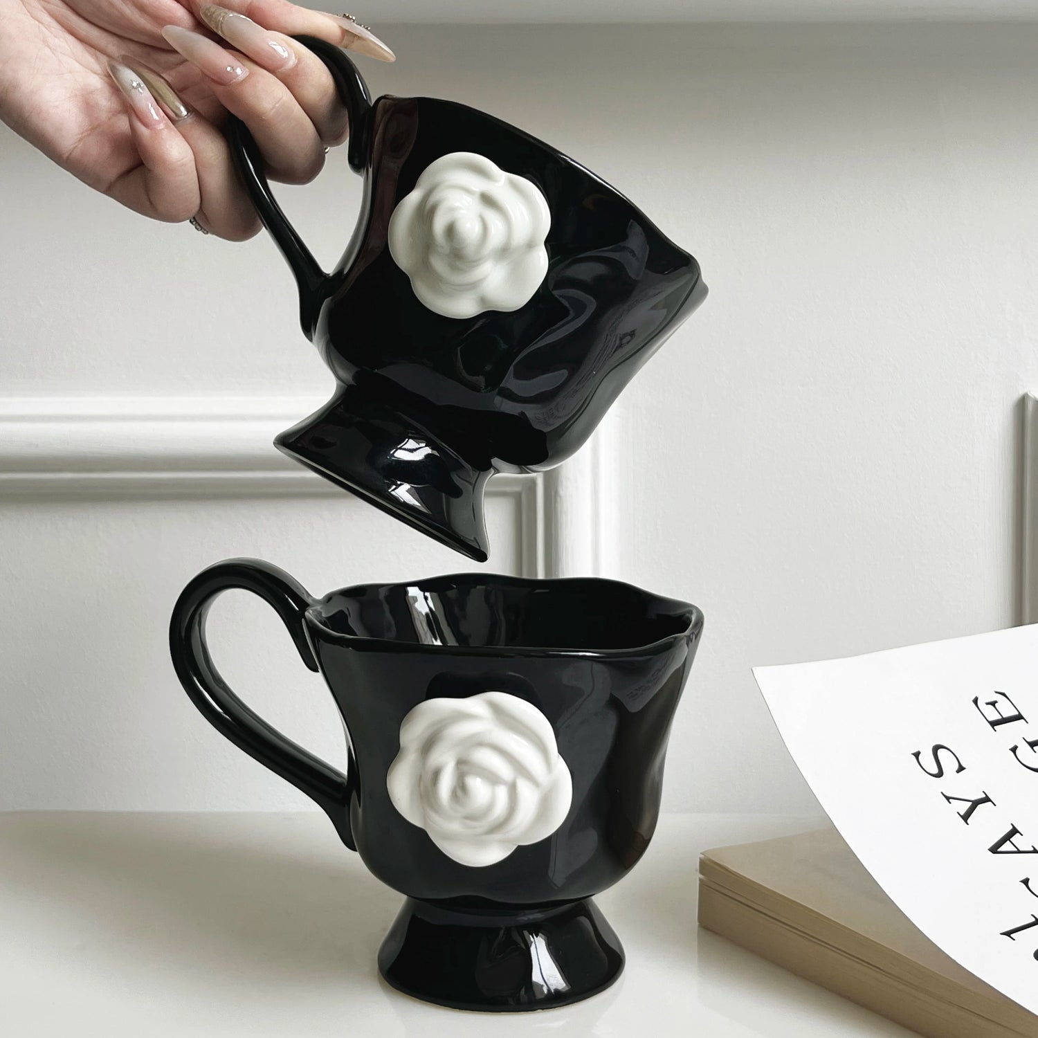 Enjoy your favorite beverage in style with the Camellia Flower Black Mug. This elegant mug features a striking black background that beautifully highlights the delicate and intricate design of camellia flowers