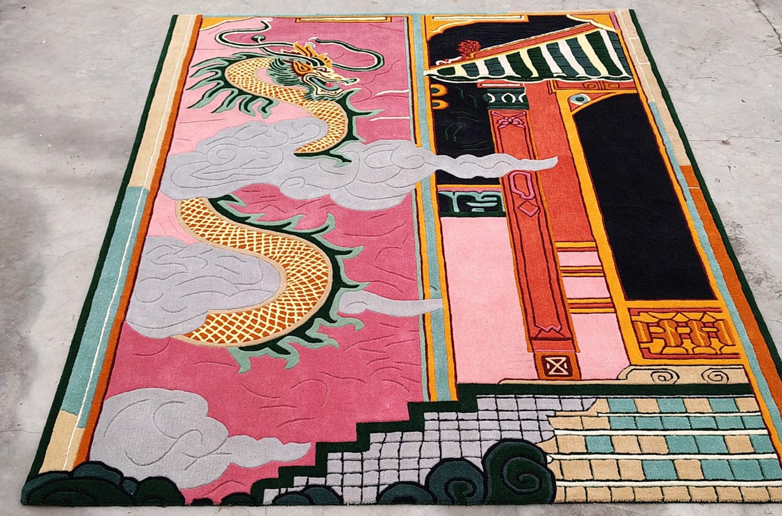 Colorful rug with dragon design on a plain background