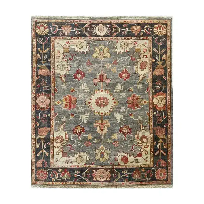 The Charming Floral Cascade Hand Knotted Area Rug features a delightful array of intricate floral motifs cascading across a soft backdrop, creating a vibrant focal point for any room. Crafted with care, this rug combines traditional artistry with modern charm, adding warmth and elegance to your space.
