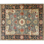 This image showcases a charming floral cascade hand-knotted area rug with intricate patterns. The rug features a harmonious blend of earthy tones, including deep reds and soft grays, creating a vintage and elegant look. Perfect for adding a touch of sophistication to any room.