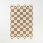 Woven rug with a geometric pattern on a white background