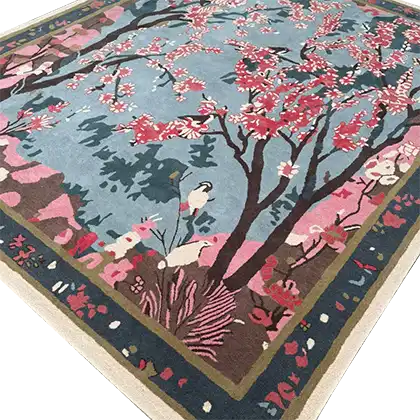 A beautiful Cherry Grove Serenity Hand Tufted area rug, perfect for enhancing any living room. The wool rug features a vibrant design with cherry blossom trees against a serene blue background, ideal for those seeking large living room rugs with artistic flair.