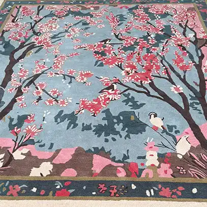 The Cherry Grove Serenity Hand Tufted Rug features a stunning abstract design with vibrant cherry blossoms on a serene blue background, perfect for adding a touch of elegance to your living room. This area rug, crafted from high-quality wool, is ideal for those seeking large living room rugs that combine beauty and durability.