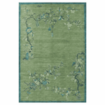 Green floral patterned rug on a white background