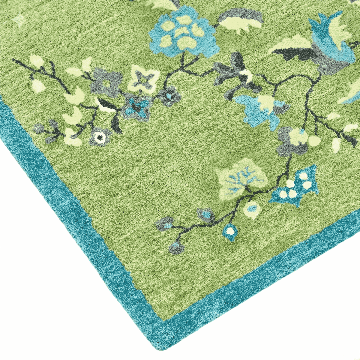 Green rug with floral patterns on a white background