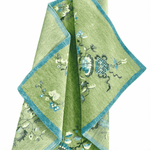 Green embroidered rug with floral patterns on a white background