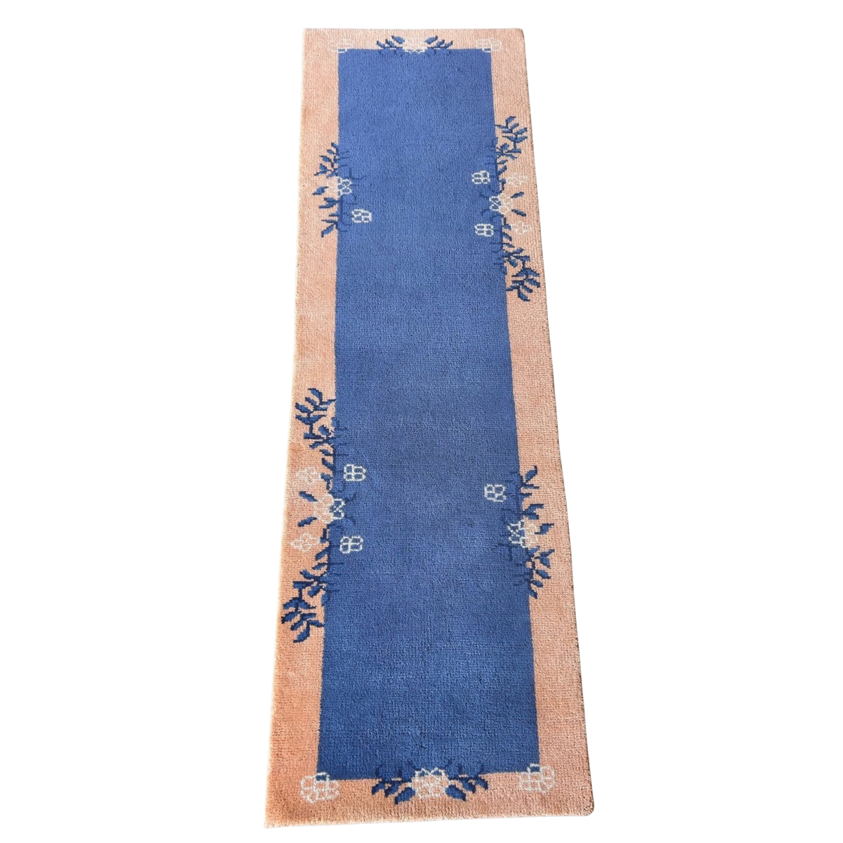 Blue runner with floral patterns on a beige border on a white background
