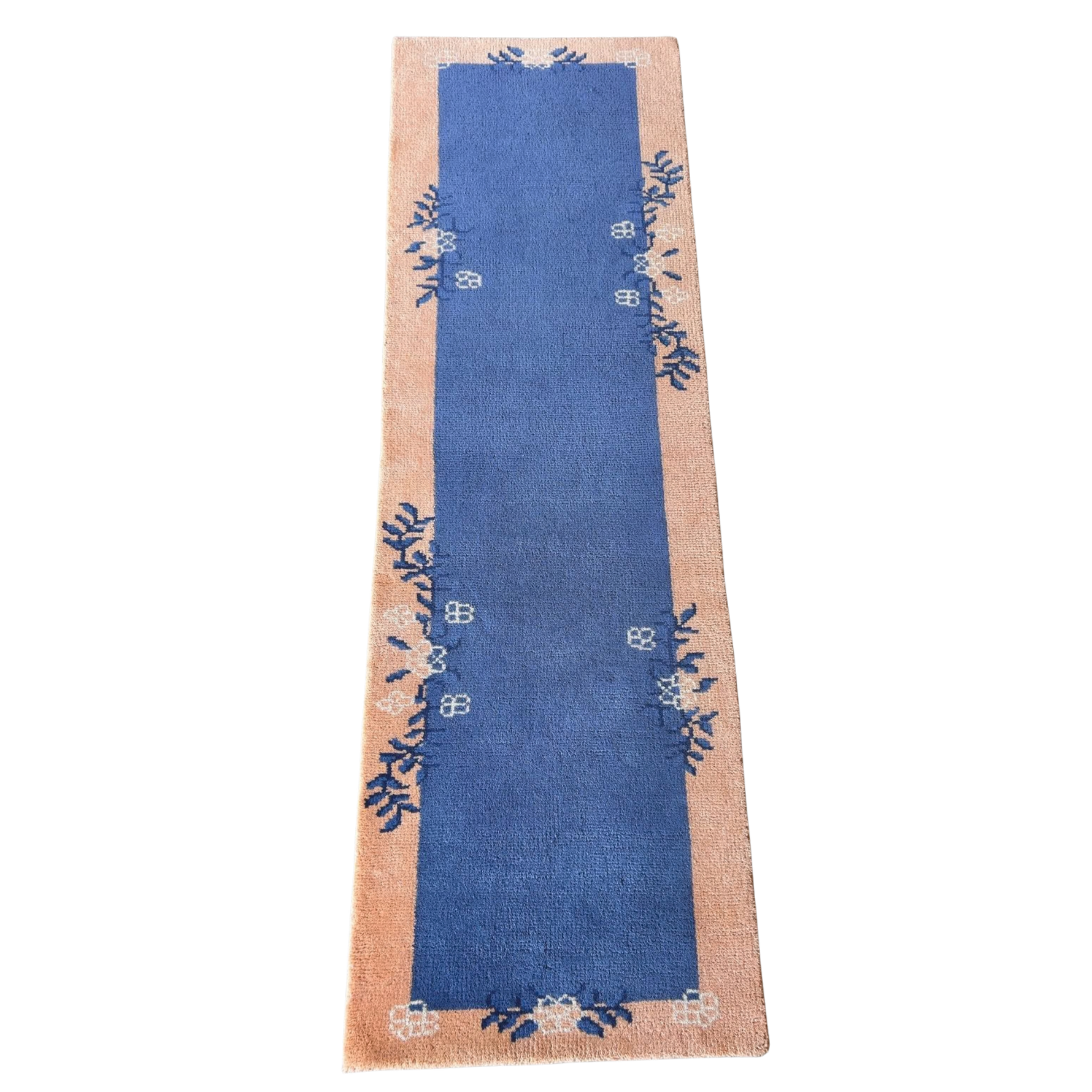 Blue runner with floral patterns on a beige border on a white background