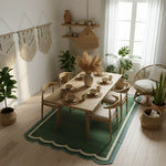 Dining room with wooden table, chairs, cotton rug, and decorative elements in a bright room.