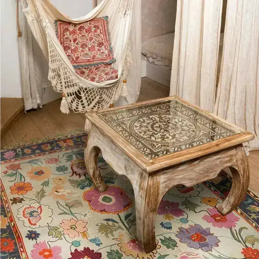 This image showcases a vibrant and colorful area rug, perfect for adding a touch of elegance to your living room. The hand-knotted rug features an intricate floral design that gives off a vintage, Persian rug vibe. It's an ideal choice for those seeking stylish area rugs for their living space.