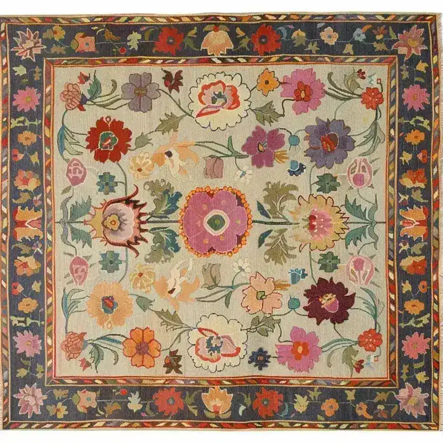 This vibrant area rug features a stunning array of floral patterns in rich colors, perfect for adding a touch of vintage charm to any living room. The hand-knotted design brings a Persian rug elegance, making it an ideal choice for those seeking unique rugs for their living space.
