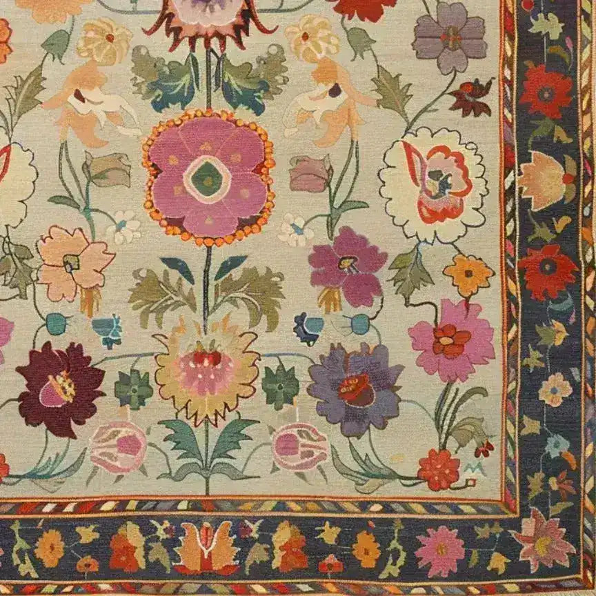 Vibrant and intricate hand-knotted area rug featuring a colorful floral motif, perfect for adding a vintage touch to your living room. This Persian-inspired design showcases an array of flowers in rich hues, framed by a detailed border, making it an ideal choice for those seeking elegant area rugs for a living room.