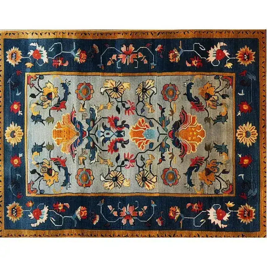 This vibrant and colorful Carnival Hand Tufted Wool Rug features an intricate floral design, perfect as a large area rug for living rooms. Its rich hues and detailed patterns make it an ideal centerpiece for any living room area, adding warmth and elegance with its woolen texture.