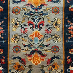 Vibrantly patterned Colorful Carnival Hand Tufted Wool Rug featuring intricate floral designs and bold colors, perfect as a large area rug for your living room. This exquisite wool rug adds warmth and style to any living room setting.