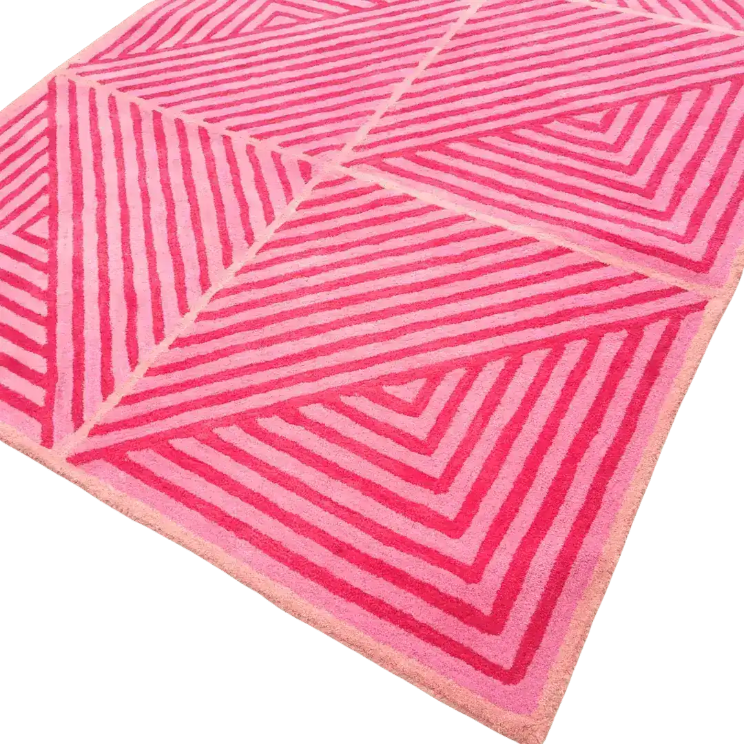 This image showcases a vibrant Contemporary Hot Pink Geometric Hand Tufted Wool Rug, perfect for adding a bold statement to large living room rugs or dining room carpets. The rug features striking geometric patterns in various shades of pink, ideal for enhancing the decor of a dining room or living room with a touch of modern style.
