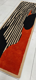 Long rectangular rug with zebra pattern on a tiled floor