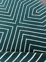 Teal fabric with white geometric pattern