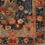 A detailed close-up of the Deer in the Meadow Hand Knotted Area Rug, featuring intricate floral patterns and a deer motif, perfect for adding a touch of elegance to any living room. This exquisite Persian rug design showcases vibrant colors and skilled craftsmanship, ideal for those seeking luxurious rugs for living room decor.