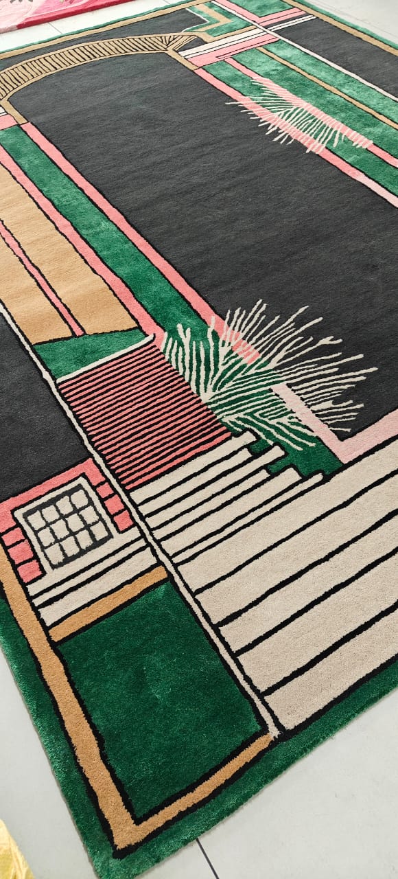 Decorative rug with geometric pattern on a white floor