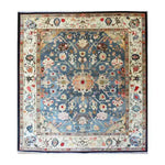The "Elegant Blue Floral Hand-Knotted Area Rug" showcases a sophisticated floral design in serene blue hues, adding timeless beauty to any room. Hand-knotted for durability, it blends artistry with lasting quality.
