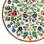 The Enchanted Arbor Hand Tufted Round Rug is a vibrant wool area rug perfect for office settings. Its intricate floral design features colorful blooms and leafy branches, offering a striking centerpiece for large office areas. This elegant round rug combines artistry and function, enhancing any office space with its detailed craftsmanship.