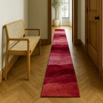 Ethereal Waves Hand Tufted Wool Runner Rug in a hallway setting, showcasing its elegant, wavy pattern in rich red tones. This contemporary rug adds a touch of sophistication to any space, perfect for use as a hallway runner rug, kitchen runner rug, or even a bathroom runner rug. Its luxurious wool texture makes it an ideal choice for enhancing the warmth and style of your home.