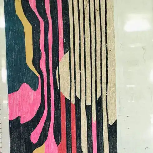 Vibrant area rug with an abstract design featuring bold pink, black, and beige stripes, ideal for adding a modern touch to living room and dining room spaces. This contemporary wool rug showcases a unique pattern perfect for enhancing the aesthetics of your home decor.