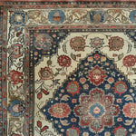 A detailed view of the Floral Euphoria Hand Knotted Area Rug, showcasing an intricate design of vibrant floral patterns in rich hues. This vintage rug features a Persian-inspired motif, perfect for adding a touch of elegance to living rooms. Ideal as an 8x10 area rug, it blends seamlessly with both traditional and modern decor styles.