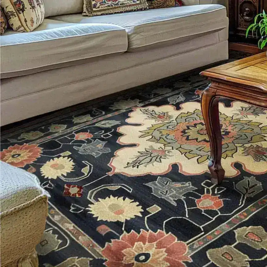 Elegant Floral Legacy Medium Hand Knotted Wool Rug showcasing intricate Persian design patterns in a cozy living room setting. This area rug adds warmth and style to the space, perfect for rugs for living room or office use.