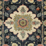 A beautifully hand-knotted wool area rug featuring intricate floral designs with a Persian-inspired motif. This medium-sized rug showcases a harmonious blend of colors, making it perfect for enhancing the aesthetic of your living room or office space. Ideal for those seeking elegant and timeless living room area rugs.