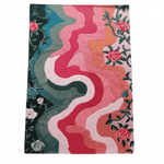 Colorful abstract patterned rug with floral elements on a white background