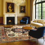 Elegant living room featuring a Flourishing Tapestry Hand Knotted Area Rug with intricate floral patterns, reminiscent of vintage Persian rugs. The 8x10 rug adds a touch of luxury to the space, complementing the classic decor with blue velvet chairs, a cream sofa, and a wooden coffee table set against a warm-toned wooden floor.