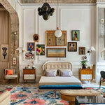 A beautifully styled living room showcasing the Garden Breeze Hand Tufted Area Rug. This wool rug features a vibrant floral pattern with shades of blue and pink, creating a stunning centerpiece. Ideal for adding a touch of elegance to area rugs for living room settings.