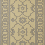 A close-up of a patterned area rug with a beige background and a gray geometric lattice design and border.