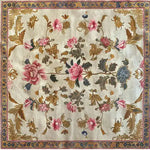 Elegant Golden Glory Square Hand Tufted Wool Rug featuring a vibrant floral design, perfect as a large living room rug or a stylish addition to any bedroom. This luxurious square area rug showcases intricate patterns with pink and blue flowers, enhancing the charm of your living space.