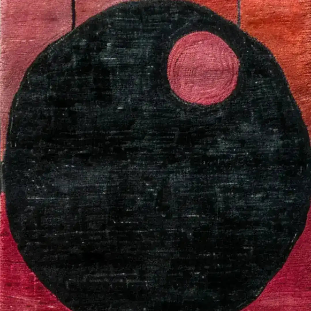 Close-up view of a Graphic Grid Hand Tufted Wool Runner Rug featuring an abstract design with a large black circle and a smaller red circle on a warm red background. Perfect for adding a contemporary touch to your office or kitchen as a stylish area rug.