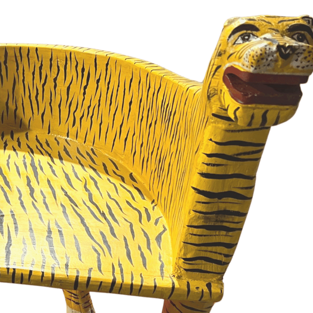 The Hand Crafted Wooden Tiger Maharaja Chair in Yellow is a stunning piece of furniture, meticulously crafted by skilled artisans. Featuring a regal tiger motif carved into the backrest and a vibrant yellow hue, this chair adds exotic elegance to any room. With its curved armrests and spacious seat, it combines style with comfort, making it a perfect statement piece for your living space.