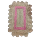 Top view of a handmade pink scalloped border jute rug, ideal for adding a charming touch to dining rooms or offices. This area rug features a natural jute texture with a vibrant pink border, perfect for dining room area rugs or rugs for office spaces.
