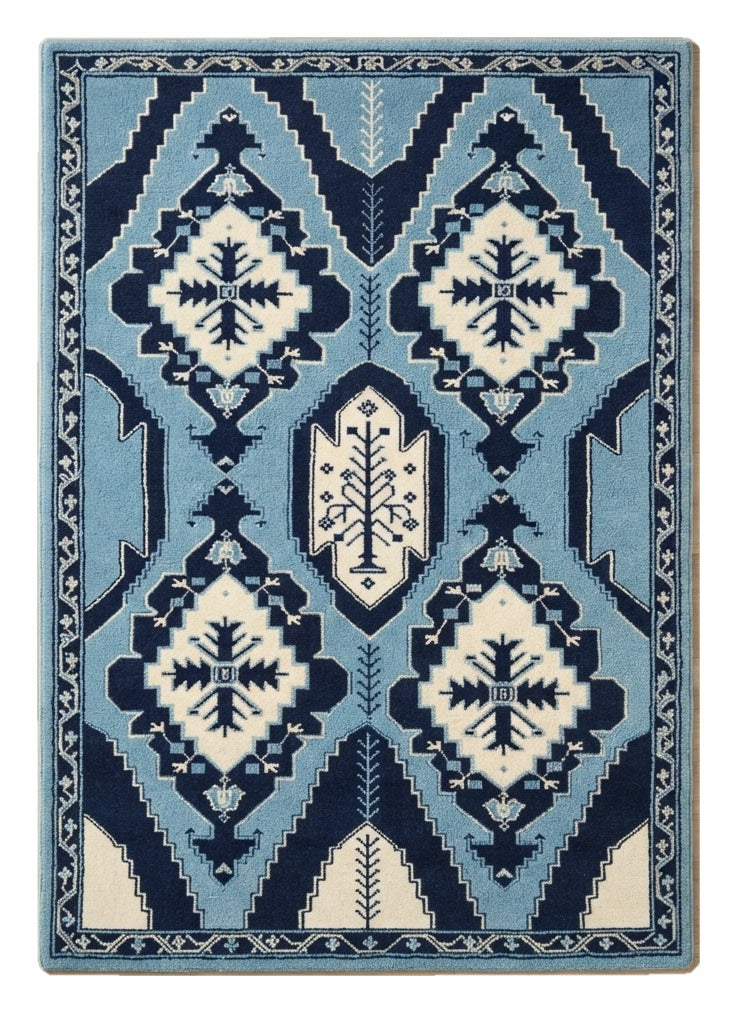 Indigo Totem Kilim Hand Tufted Rug — navy, light blue, cream tribal rug by Maia Homes on a white background