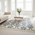 Living room with a patterned rug, sofa, and coffee table.