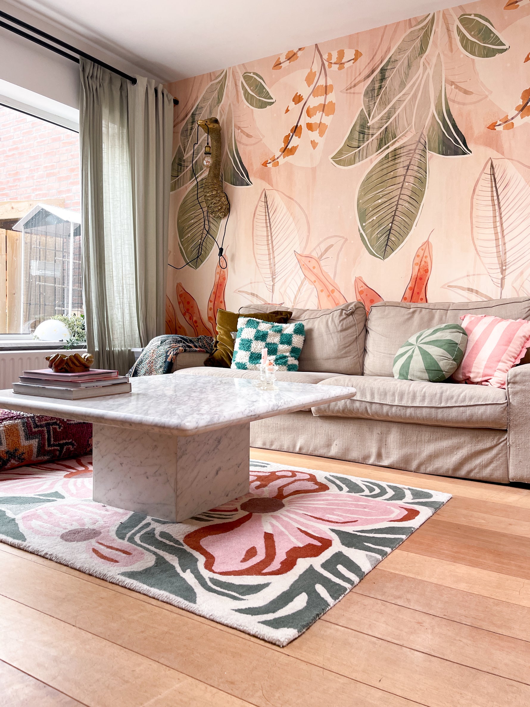 Living room with floral rug, sofa, and coffee table.